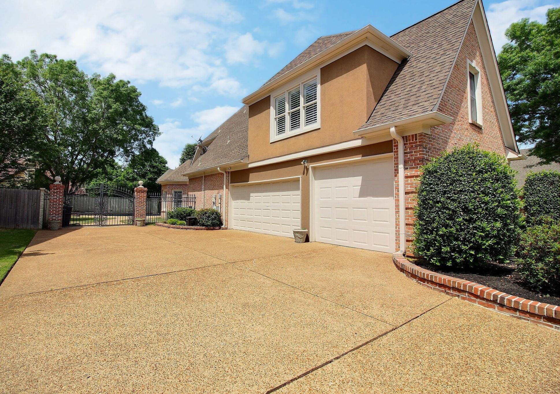 595 Kenrose Street Collierville, TN 38017 - Photo 2 of 38 a front view of a house with a yard and garage