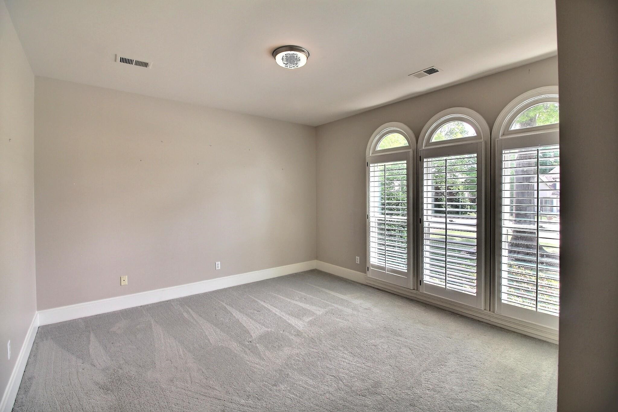 595 Kenrose Street Collierville, TN 38017 - Photo 22 of 38 an empty room with windows and closet