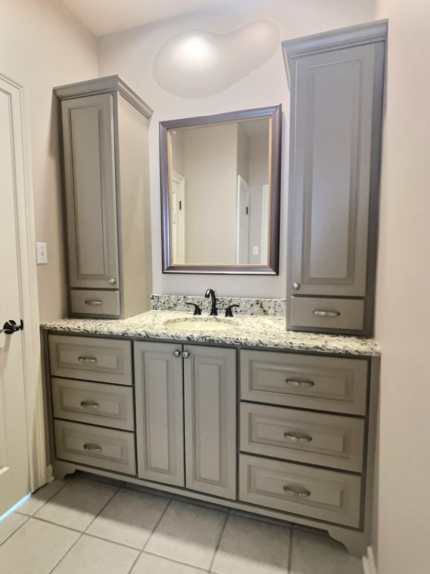 595 Kenrose Street Collierville, TN 38017 - Photo 24 of 38 a bathroom with a sink and a mirror