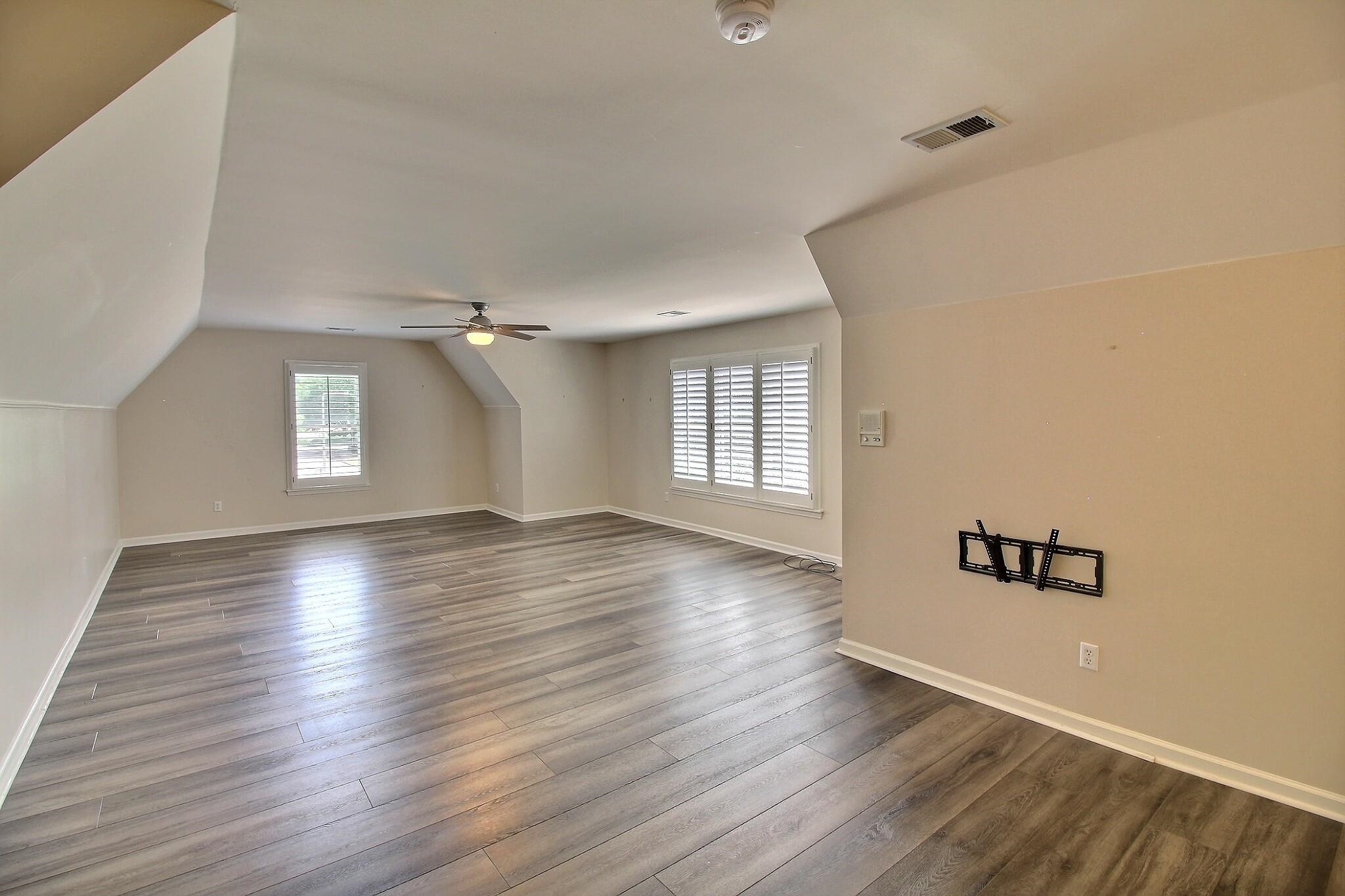 595 Kenrose Street Collierville, TN 38017 - Photo 30 of 38 an empty room with wooden floor and windows