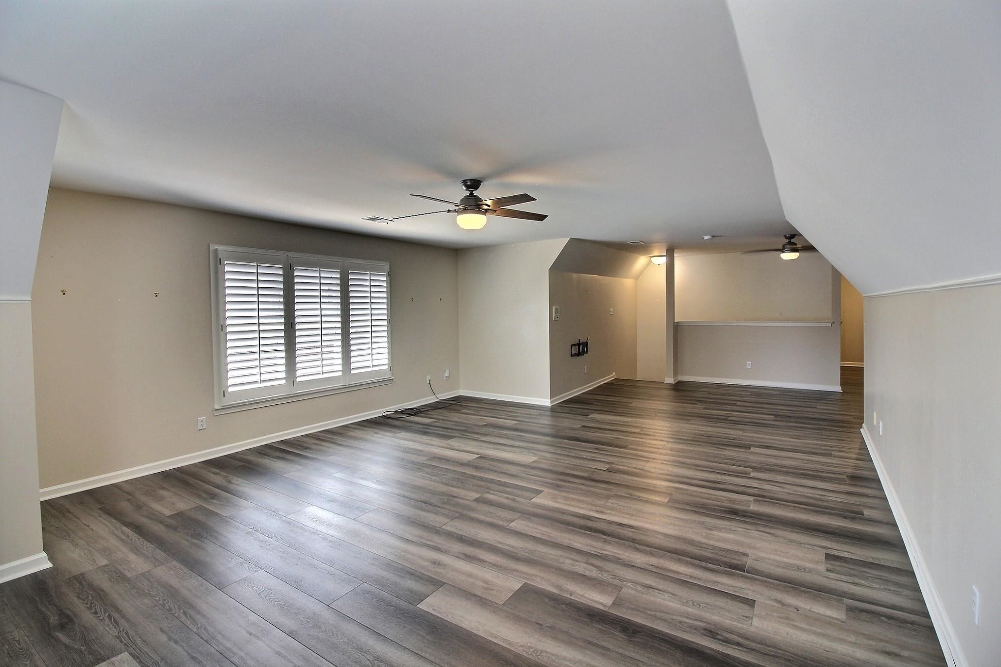 595 Kenrose Street Collierville, TN 38017 - Photo 31 of 38 wooden floor in an empty room with a window
