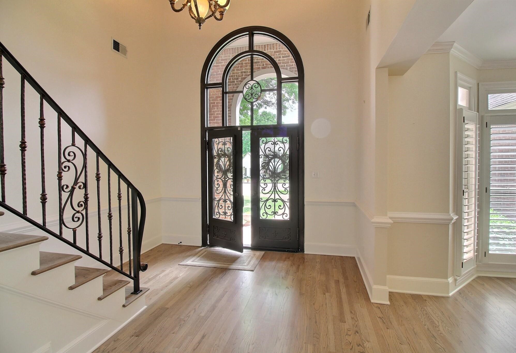 595 Kenrose Street Collierville, TN 38017 - Photo 4 of 38 a view of an entryway with wooden floor door and a window