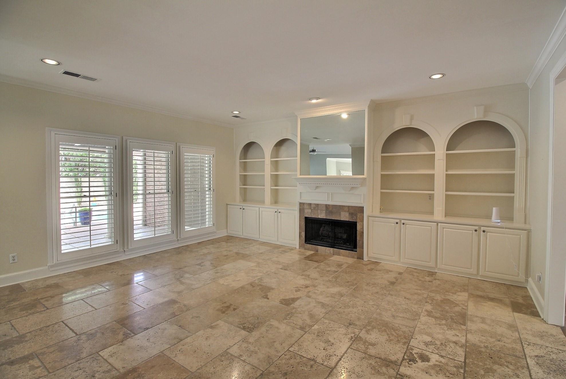 595 Kenrose Street Collierville, TN 38017 - Photo 7 of 38 a view of an empty room with a fireplace and a window