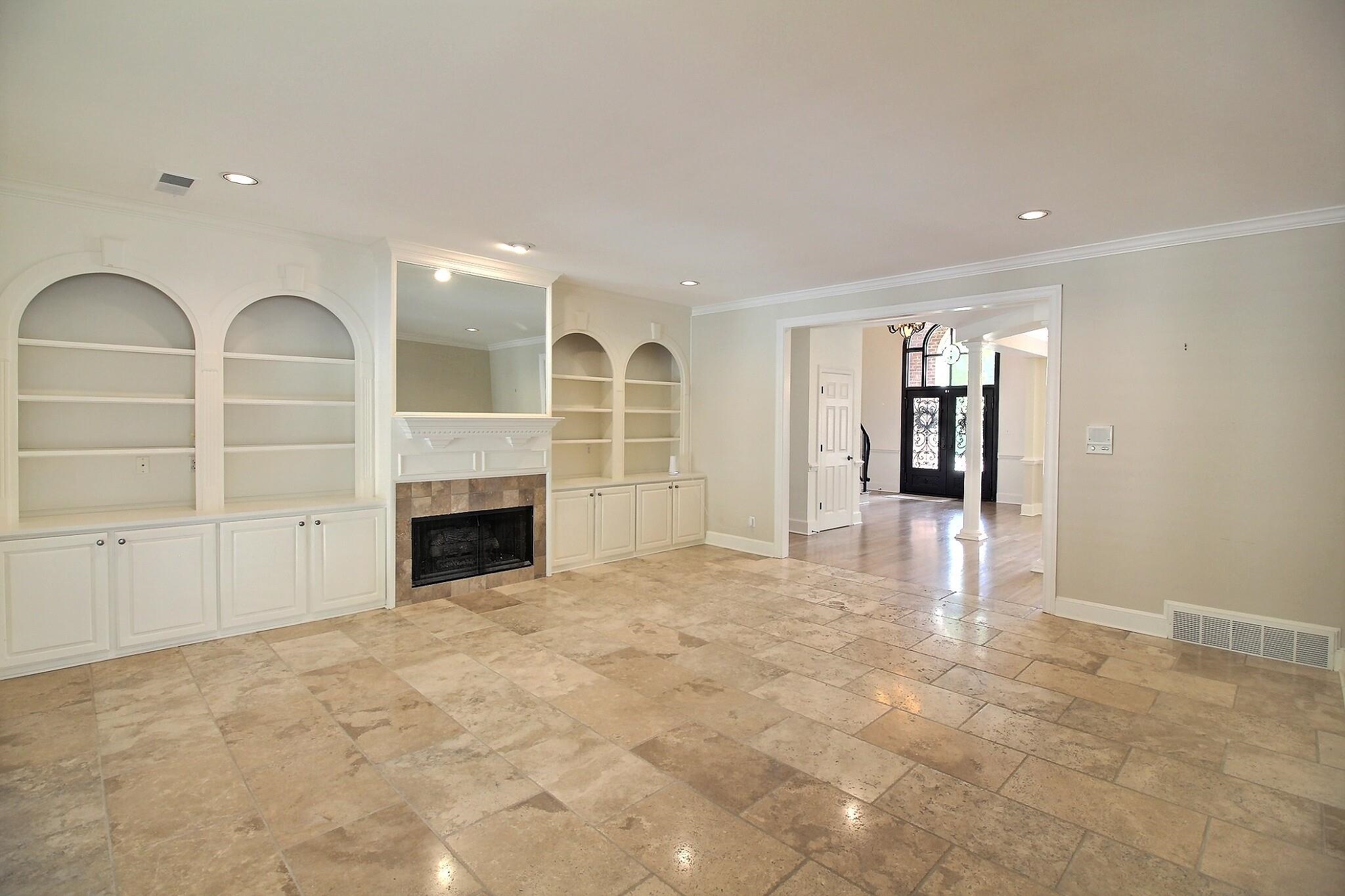595 Kenrose Street Collierville, TN 38017 - Photo 8 of 38 a view of an empty room with a fireplace and window