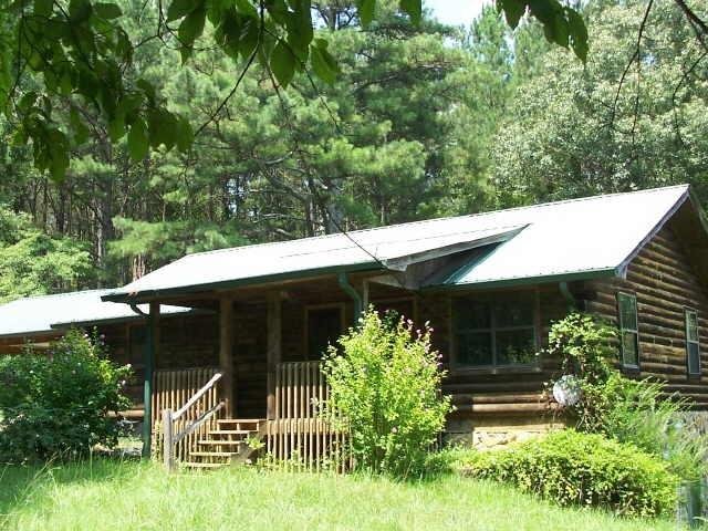 a view of a house with a yard and plants