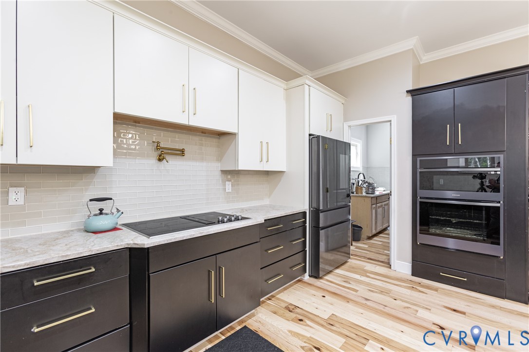 12554 Kain Road Glen Allen, VA 23059 - Photo 23 of 75 a kitchen with a sink stainless steel appliances and cabinets