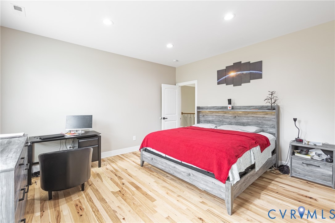 12554 Kain Road Glen Allen, VA 23059 - Photo 35 of 75 a bedroom with a bed and a flat screen tv