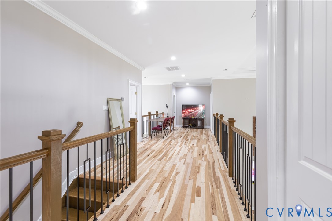 12554 Kain Road Glen Allen, VA 23059 - Photo 36 of 75 a view of a hallway with wooden floor and stairs