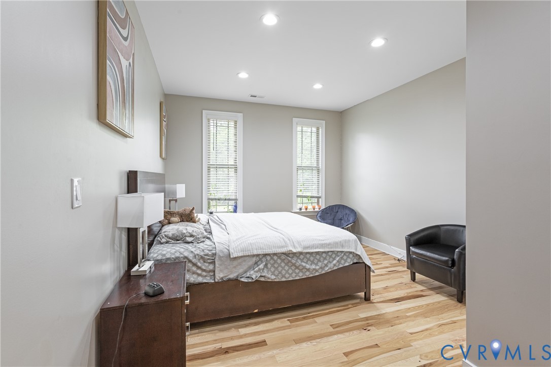 12554 Kain Road Glen Allen, VA 23059 - Photo 45 of 75 a bedroom with a bed and wooden floor