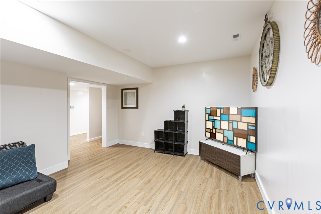 12554 Kain Road Glen Allen, VA 23059 - Photo 54 of 75 a room with furniture and a wooden floor