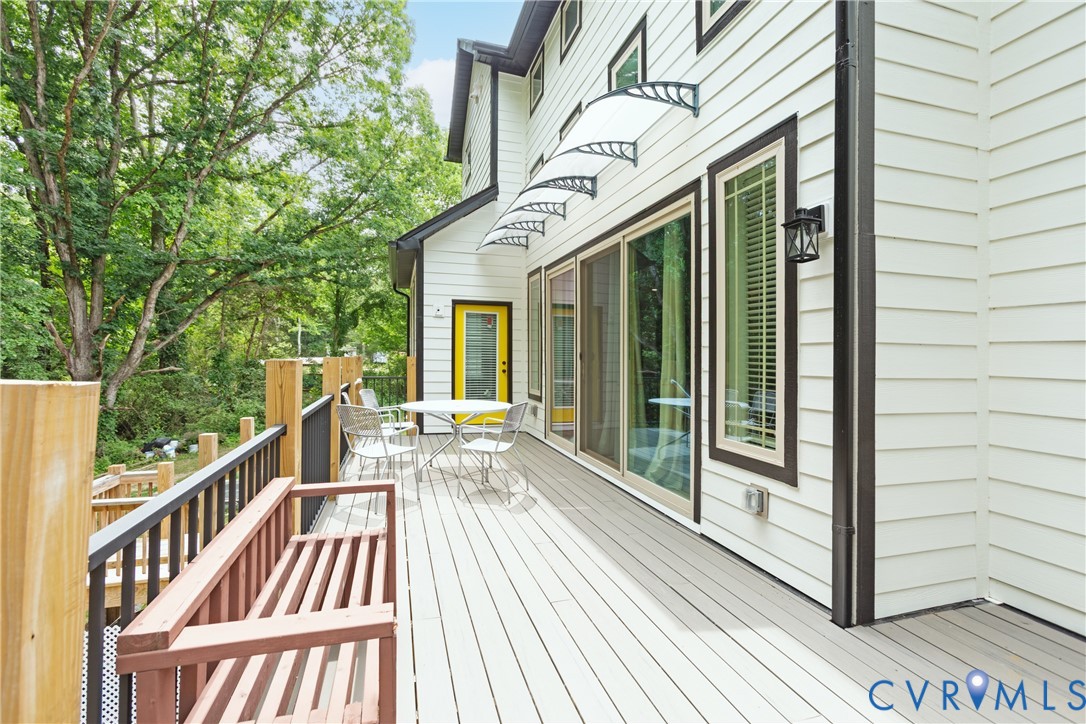 12554 Kain Road Glen Allen, VA 23059 - Photo 68 of 75 a view of a balcony with wooden floor and iron stairs