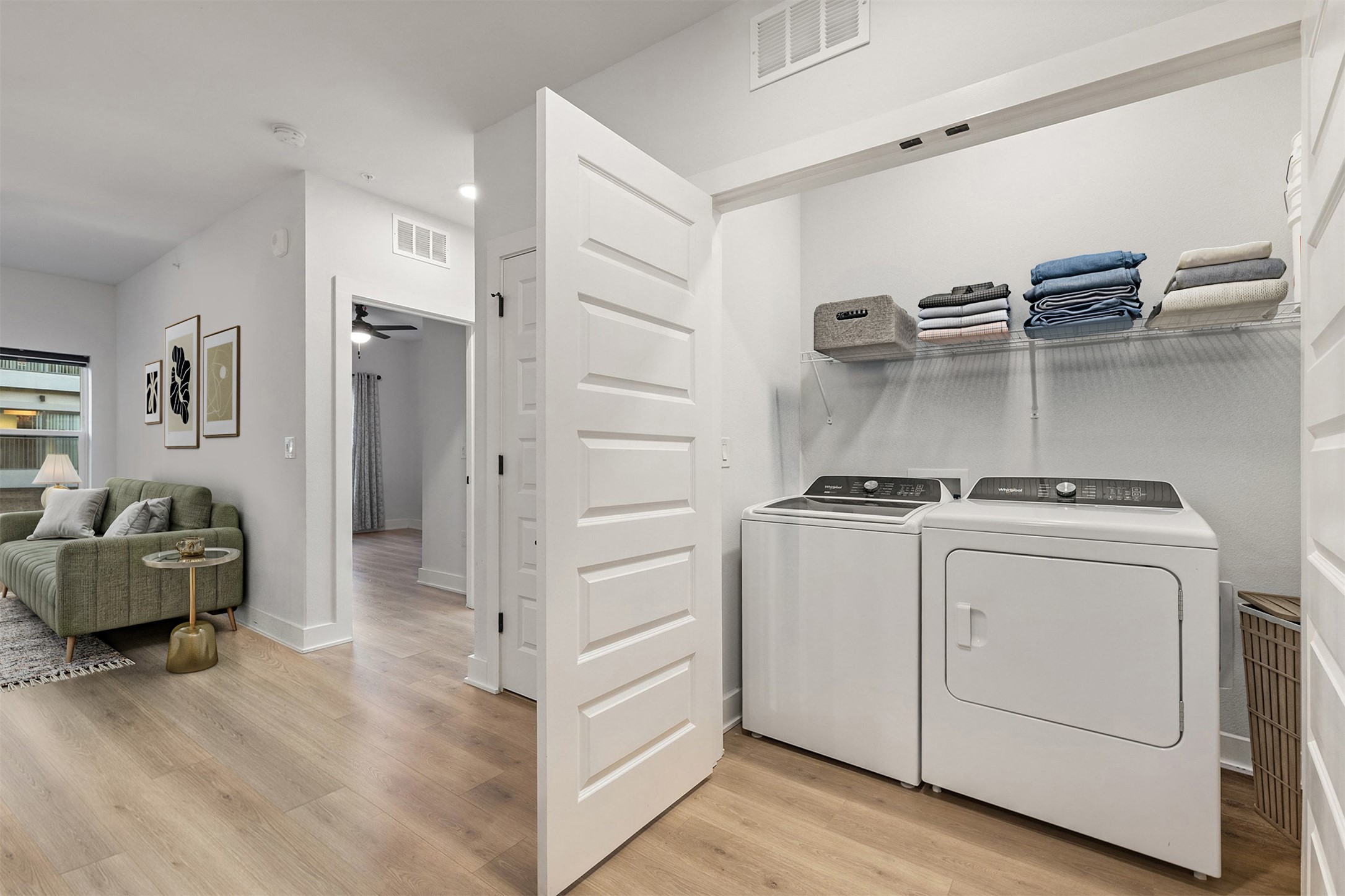 2500 Longview Street, Unit 418 Austin, TX 78705 - Photo 8 of 40 Washroom featuring light wood-type flooring, washing machine and dryer, and ceiling fan