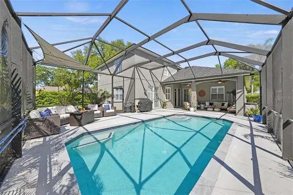 a view of outdoor kitchen with sitting area