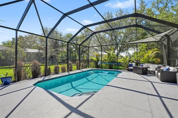 a view of swimming pool with a patio