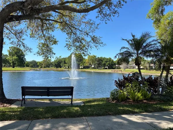 a view of a bench in front of a house