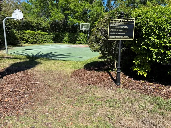 a view of outdoor space with playground and green space