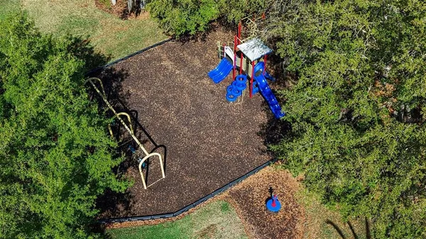 a picture of a bench in front of a wall