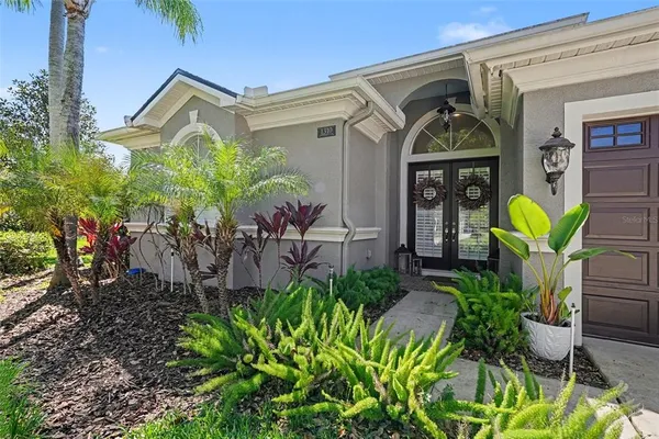 a front view of a house with garden