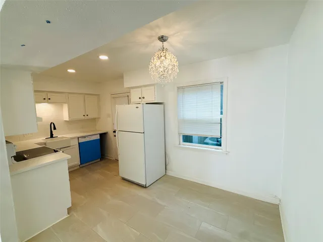 a view of a kitchen with a sink