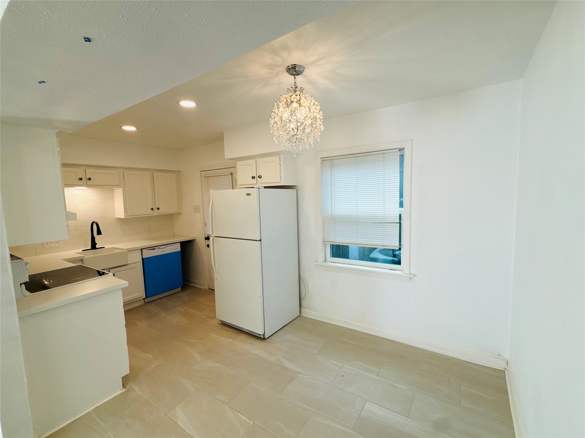 a view of a kitchen with a sink