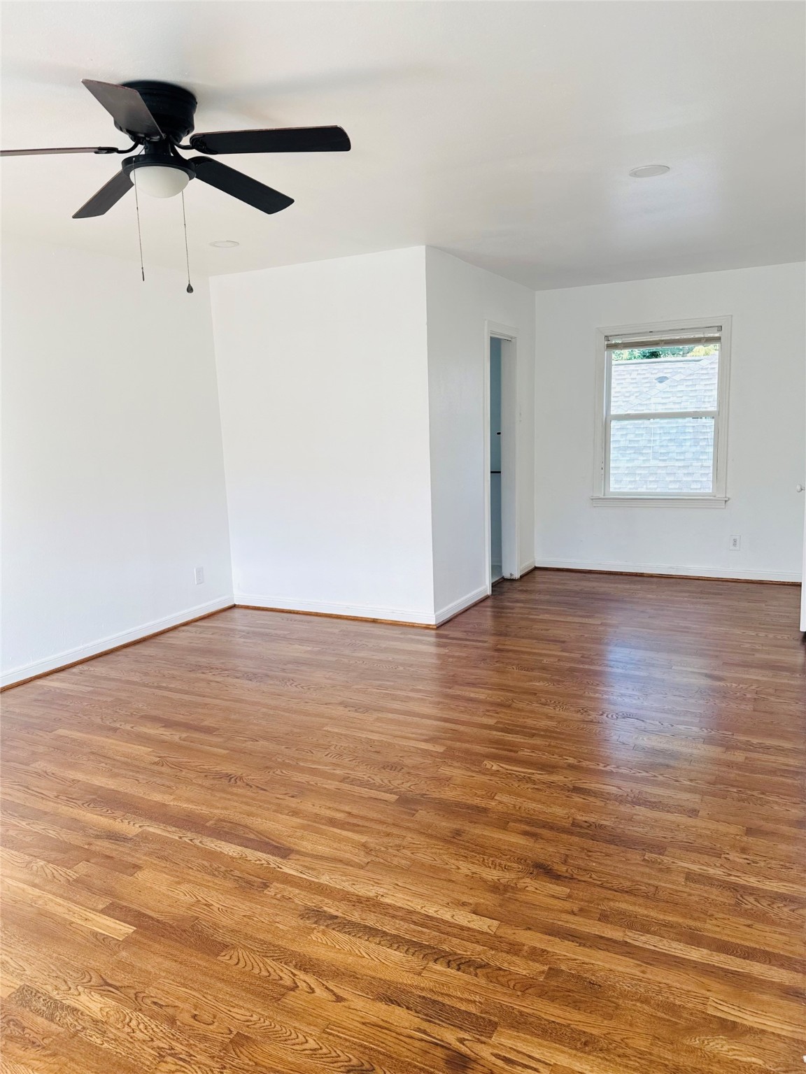 1848 Portsmouth Street, Unit 3 Houston, TX 77098 - Photo 13 of 16 wooden floor in an empty room