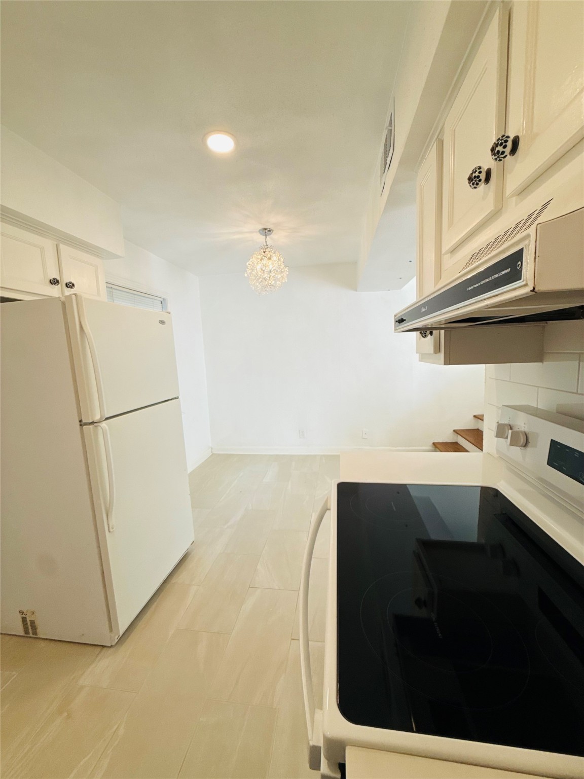 1848 Portsmouth Street, Unit 3 Houston, TX 77098 - Photo 3 of 16 a kitchen with a sink and a refrigerator