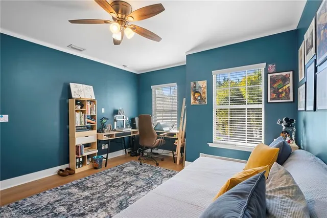 a bedroom with furniture and a window