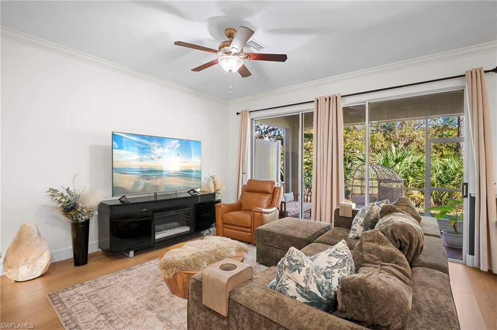 19501 Bowring Park Road, Unit 102 Fort Myers, FL 33967 - Photo 4 of 33 a living room with furniture and a flat screen tv