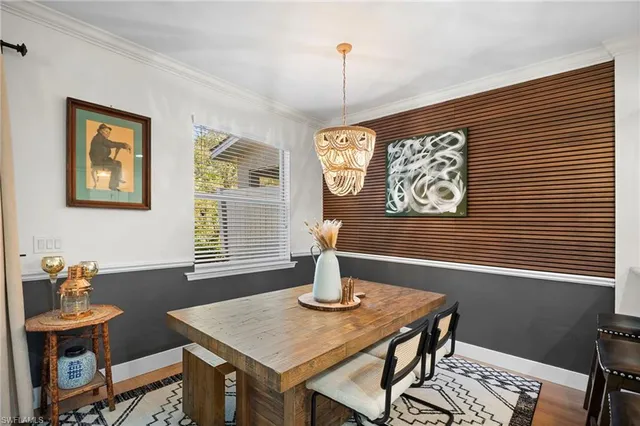 a dining room with a table and chairs