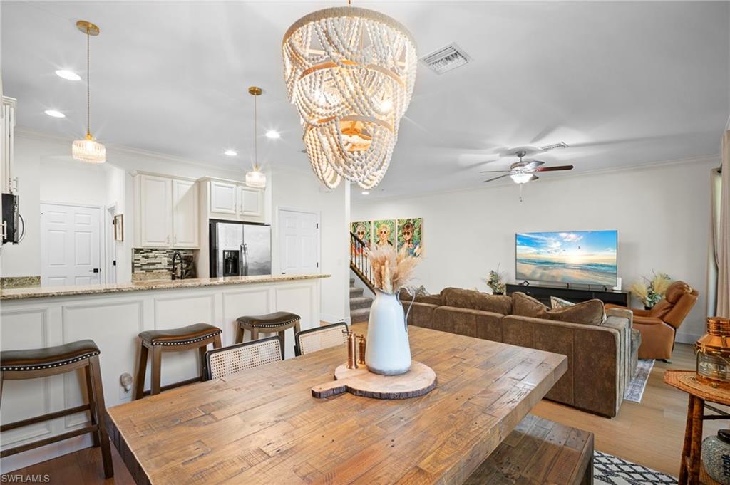 19501 Bowring Park Road, Unit 102 Fort Myers, FL 33967 - Photo 9 of 33 a view of a dining room with furniture