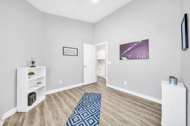 a bedroom with a bed and a desk