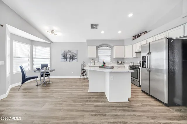 a dining room with furniture and windows
