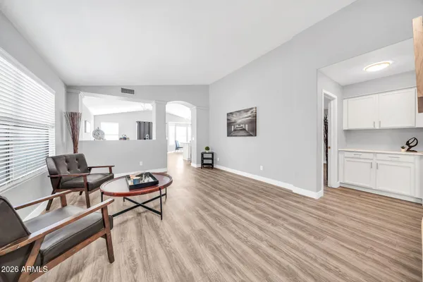 a view of a livingroom with furniture and wooden floor