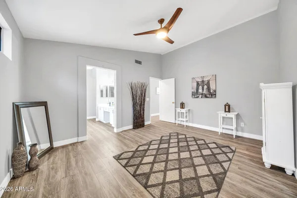 a bedroom with a bed and a table