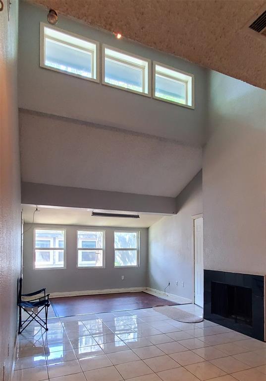 9696 Walnut Street, Unit 106 Dallas, TX 75243 - Photo 11 of 13 a view of a livingroom with wooden floor and a window