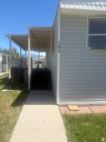 1111 North 2000 West, Unit 293 Farr West, UT 84404 - Photo 2 of 13 Light-colored horizontal siding exterior with white trim