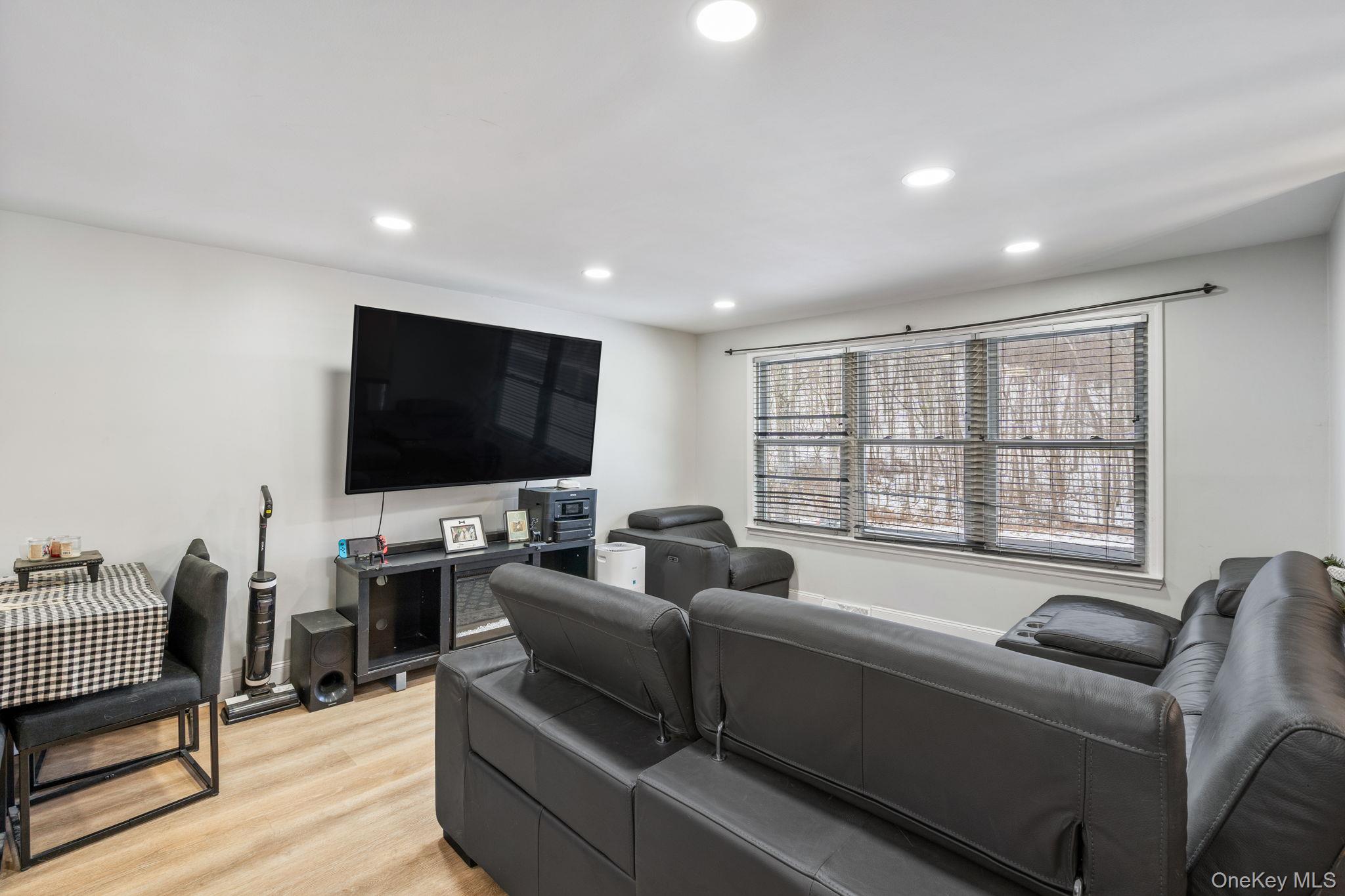 171 High Barney Road Middletown, NY 10940 - Photo 2 of 19 a living room with furniture and a flat screen tv