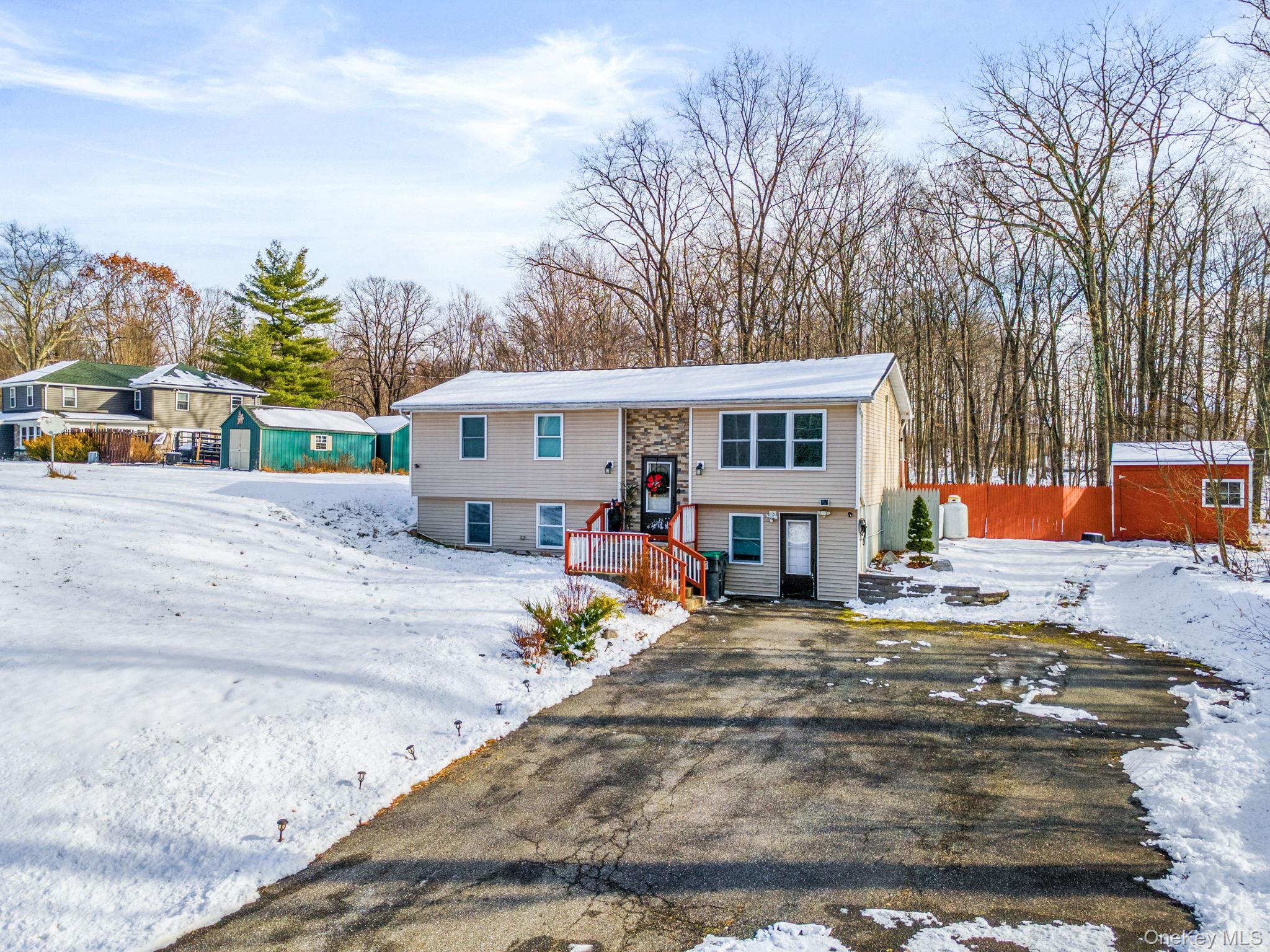 171 High Barney Road Middletown, NY 10940 - Photo 19 of 22 front view of a house with a patio
