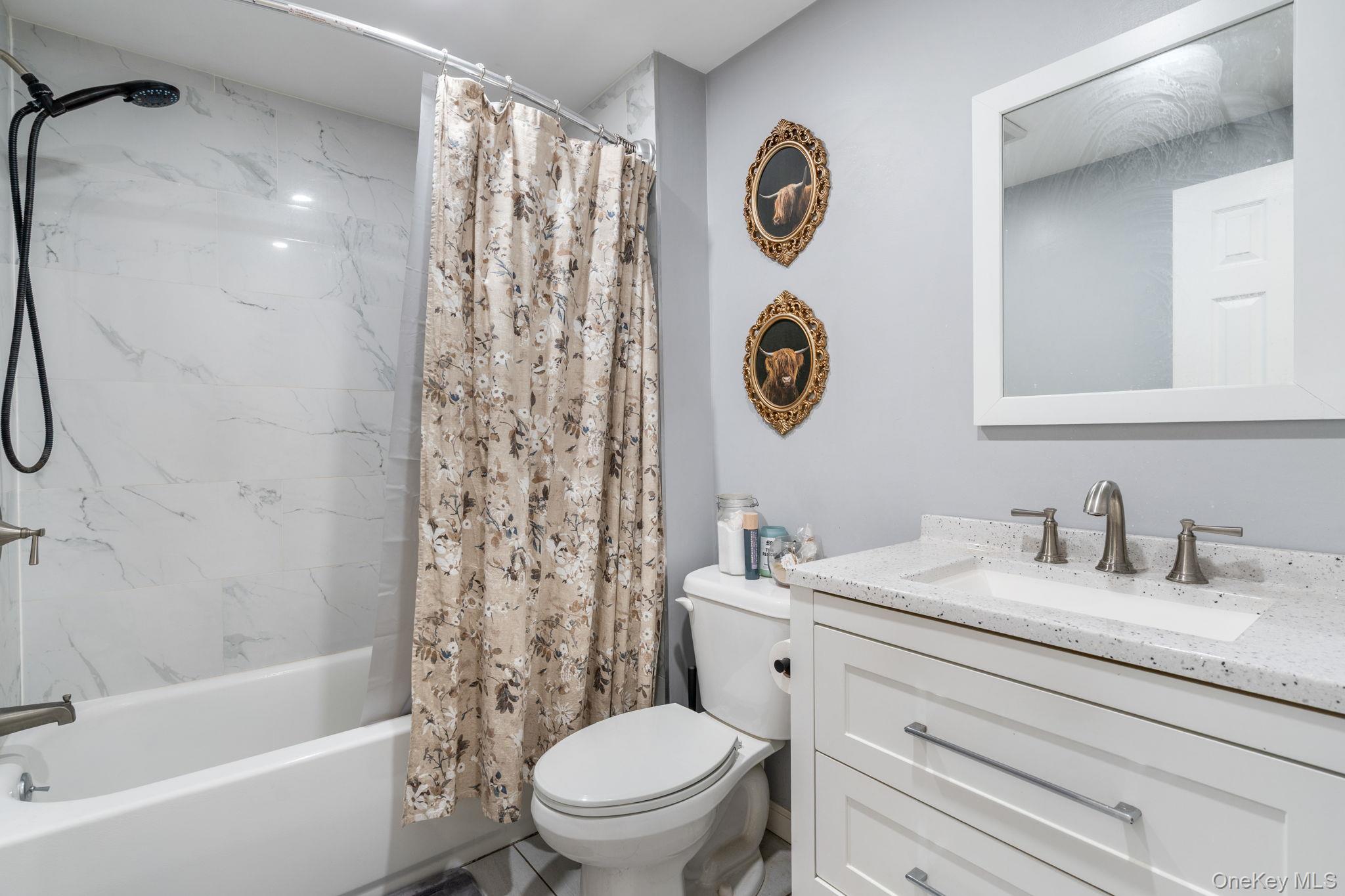 171 High Barney Road Middletown, NY 10940 - Photo 6 of 19 a bathroom with a toilet sink vanity tub and shower