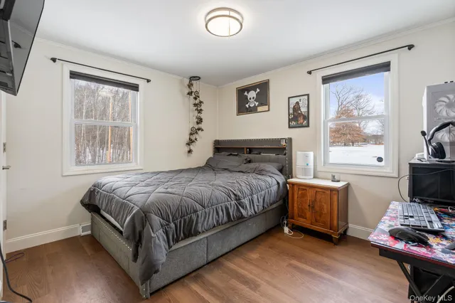 a living room with kitchen island furniture and a kitchen view