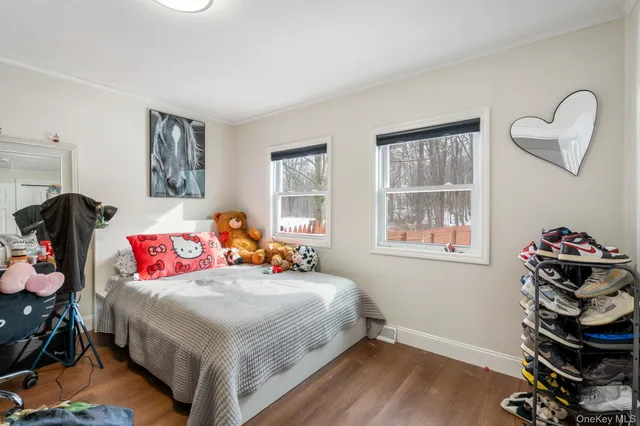 a bathroom with a toilet sink vanity tub and shower