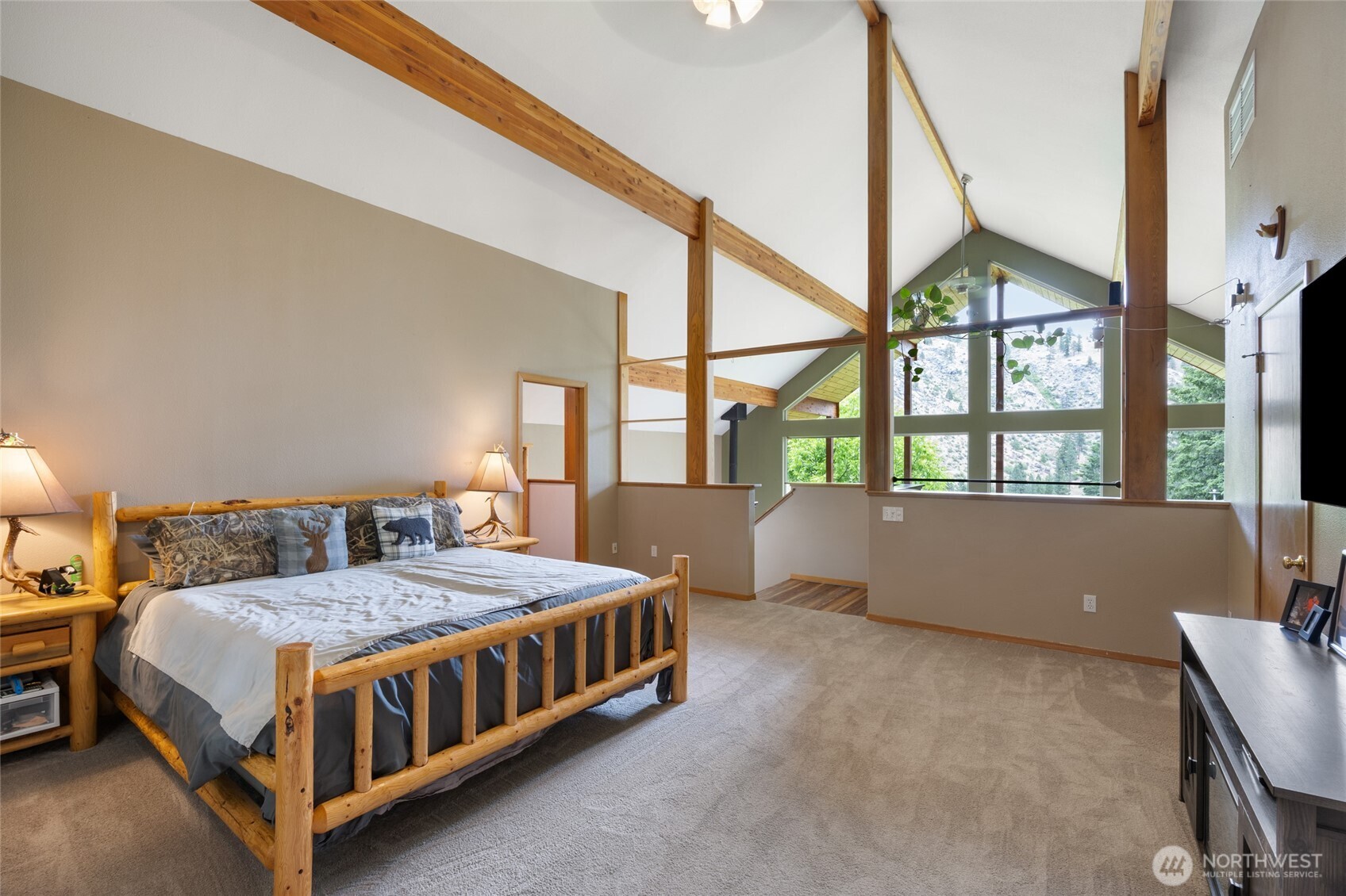 11125 Entiat River Road Entiat, WA 98822 - Photo 27 of 40 a bed sitting in a bedroom next to a window