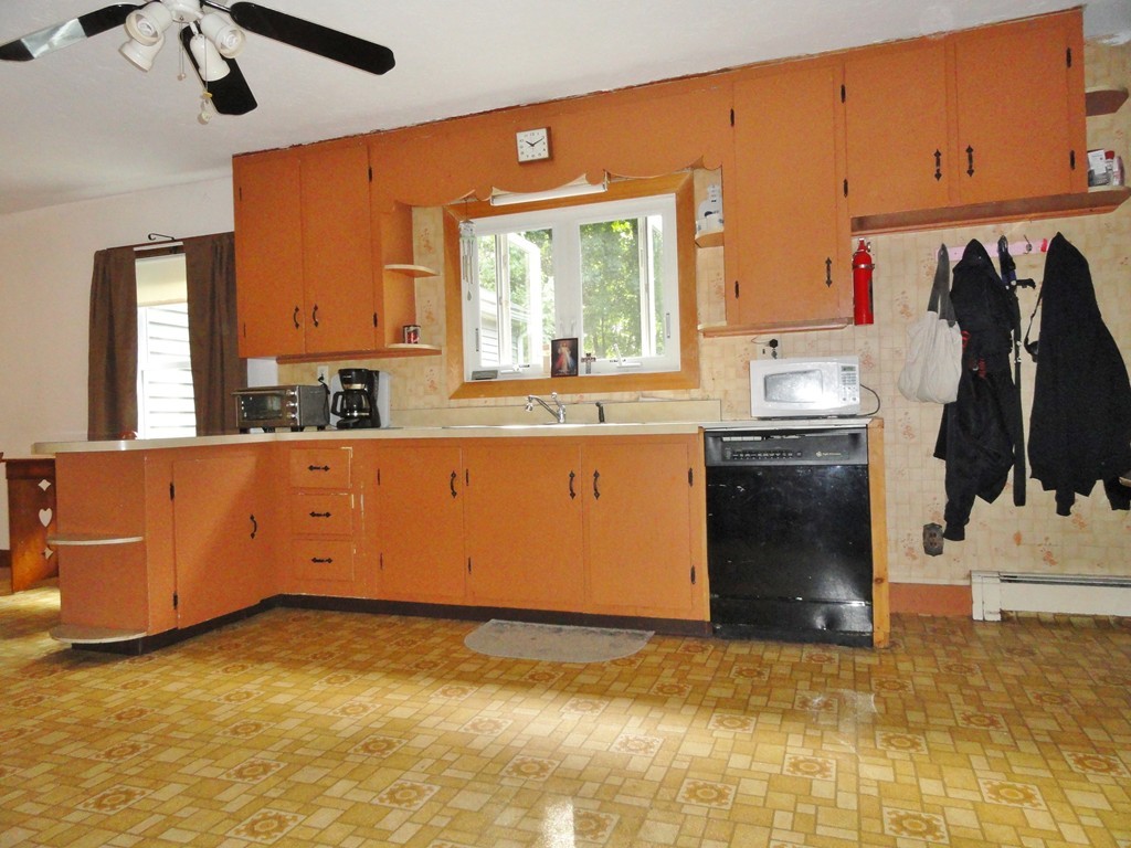 10 Inwood Road Rutland, MA 01543 - Photo 3 of 21 a kitchen with stainless steel appliances granite countertop a stove a sink and a refrigerator