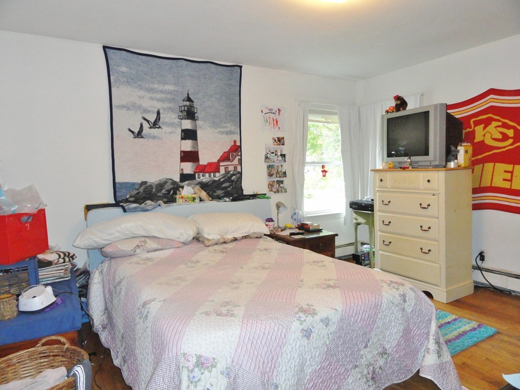 10 Inwood Road Rutland, MA 01543 - Photo 9 of 21 a bedroom with a bed and flat screen tv