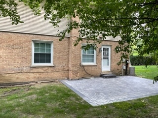 8950 East Prairie Road Evanston, IL 60203 - Photo 6 of 25 a house that has a tree in front of the house