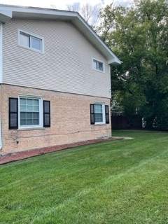 8950 East Prairie Road Evanston, IL 60203 - Photo 7 of 25 a front view of house with backyard and green space