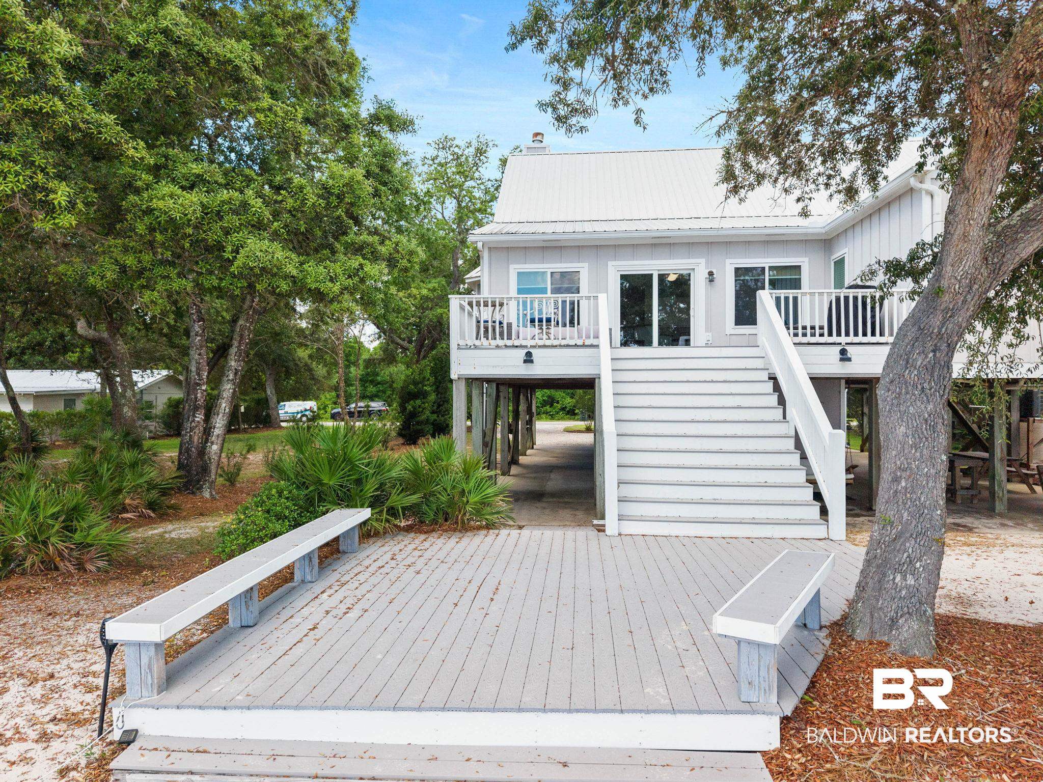 6802 Shore Drive Elberta, AL 36530 - Photo 8 of 34 Raised coastal-style residence featuring a white metal roof and light-toned siding
