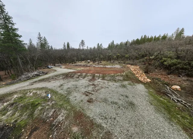 a view of outdoor space with trees all around