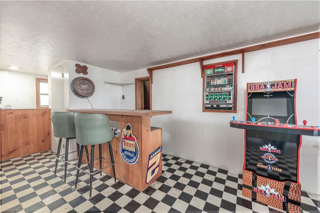 320 Deerfield Road Washington, PA 15301 - Photo 26 of 32 The wet bar area and built in casino game. How about that checker board floor ~ thats something different...