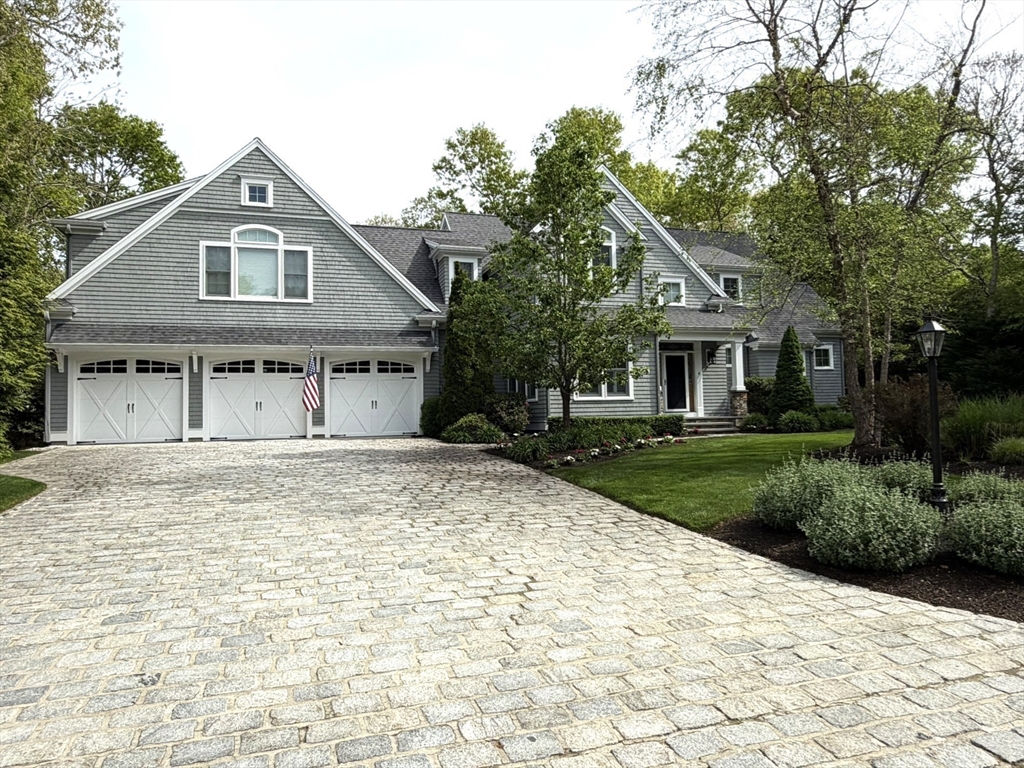 4 Tamarack Lane Sandwich, MA 02563 - Photo 2 of 42 a view of a house with a yard plants and large tree